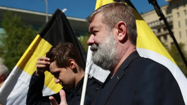 Вячеслав Мальцев с черно-желтым флагом