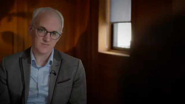 James Gallagher speaking to "Anne" who was subjected to non-consensual sex by a senior surgeon when she was a trainee.