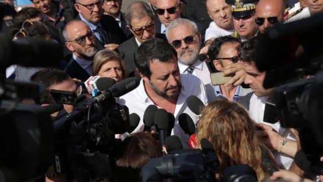 League leader Matteo Salvini is surrounded by reporters