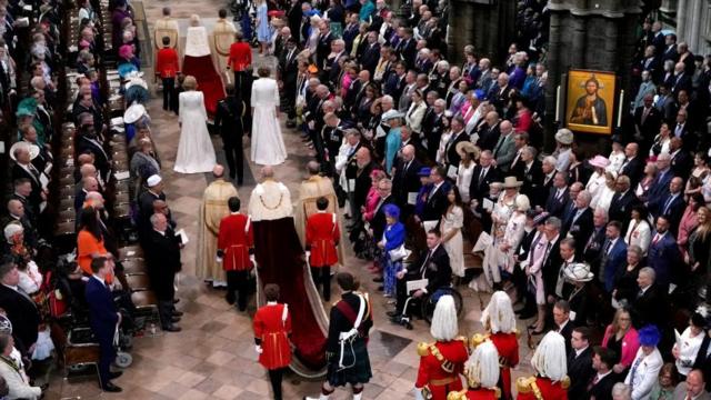 Britain's King Charles III, center, and Camilla, the Queen Consort, top center, arrive during the coronation ceremony of Britain's King Charles III at Westminster Abbey in London Saturday, May 6, 2023.