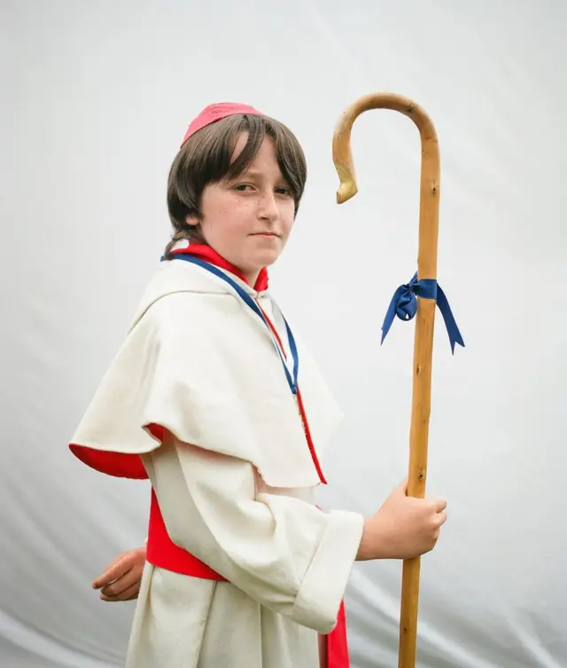 A young man in traditional Scottish dress