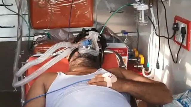 అంబులెన్సులో కోవిడ్ బాధితుడు