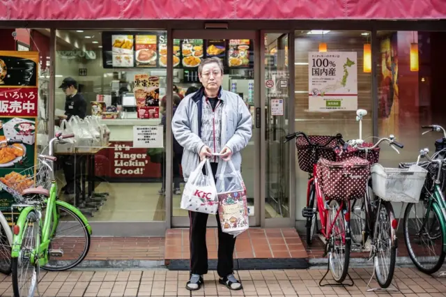 Kosei, 54 years old bought KFC for his family on December 24, 2015 in Tokyo, Japan. Some of the popular ways to spend the Japanese Christmas Eve are, spending the evening with their romantic partner, eating cakes with their family, and eating KFC for dinner. According to KFC, in 2014, approx. 43.6 million USD, nearly 4.7% of annual sales were made on December 23,24, and 25.