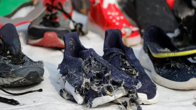 Shoes of passengers of Lion Air flight JT610 are seen at Tanjung Priok port in Jakarta, Indonesia, October 31, 2018.