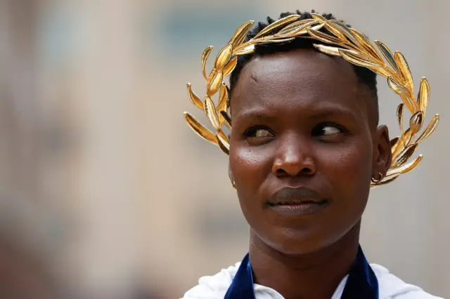 Diana Kipyogei of Kenya wears a gilded crown, Boston, the US - 11 October 2021