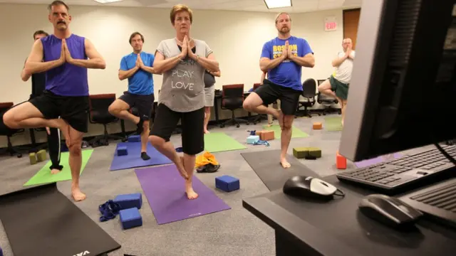 কর্মক্ষেত্রে যোগ ব্যায়ামের প্রশিক্ষণ চলছে