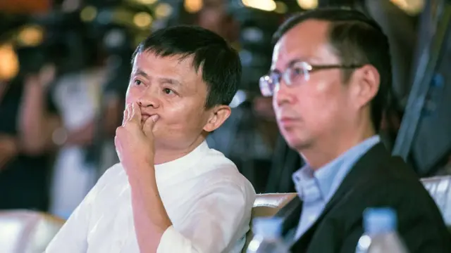 Alibaba Chariman Jack Ma (L) and CEO Zhang Yong attend a ceremony signing an agreement with Suning Group, China"s largest home appliance retailer, in Nanjing, Jiangsu province, China, 10 August 2015