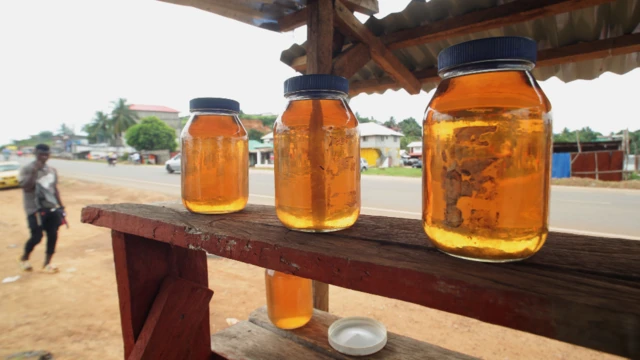 Black market gasoline products are sold on a road side in Paynesville, outside Monrovia, Liberia - Monday 6 June 2022