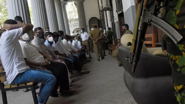 The suspects wait at Colombo High Court for a hearing of Easter Sunday bombings in 2019, in Colombo, Sri Lanka. January 12, 2022 