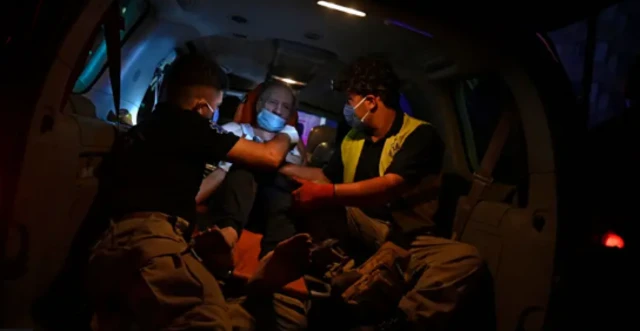 Ambulance workers help those injured in the attack 