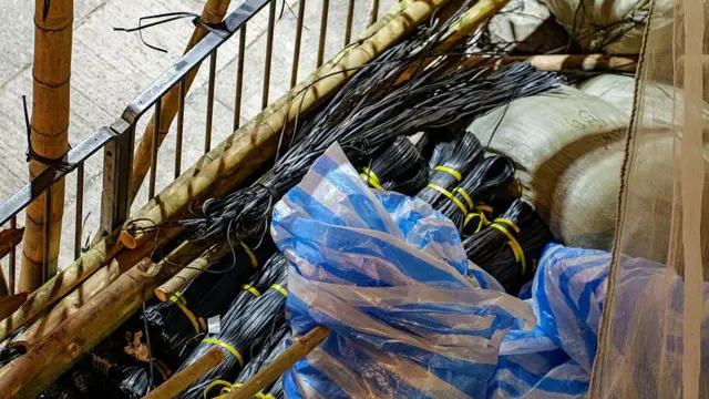 Bamboo scaffolding for building work is seen on the street in Mong Kok on November 29, 2025 in Hong Kong, China. Hong Kong's deadly Wang Fuk Court fire has highlighted its risky use of flammable bamboo scaffolding and mesh for building work