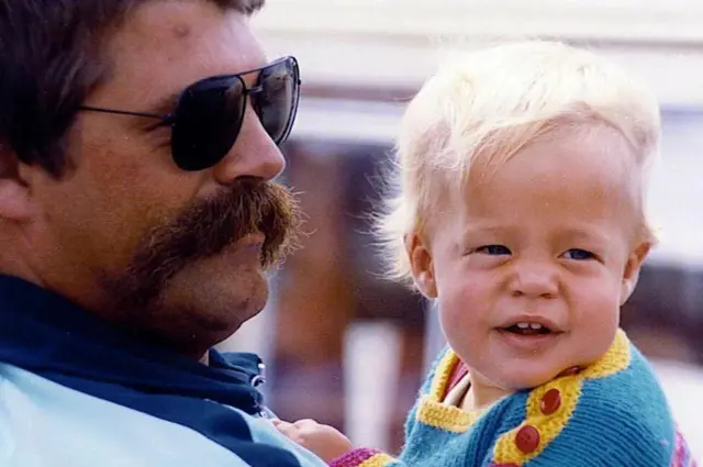 Jan pictured with his son in 1982