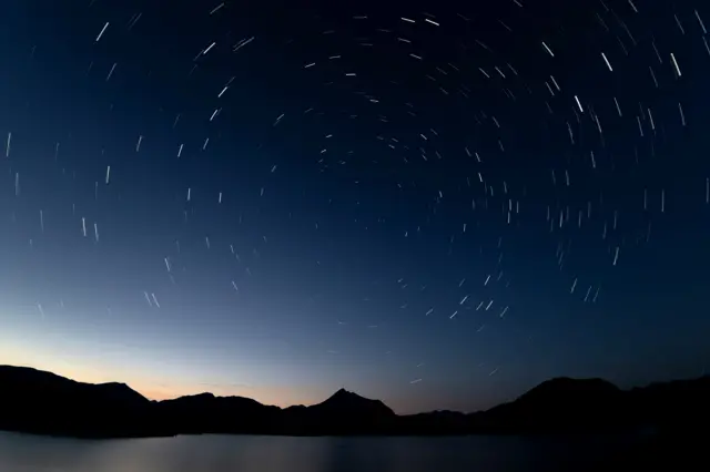 A long exposure photo shows night sky on the meteor shower's peak night in Bonar, Spain on 17 July 2025