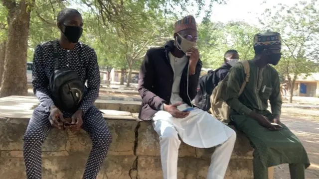 Bayero University students siddon as dem wait for lectures to show face on first day of school resumption. 18TH January, 2021.