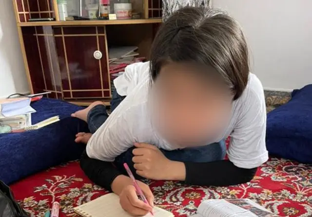 Parwana doing her home work