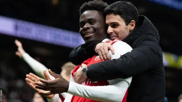 Bukayo Saka and Mikel Arteta