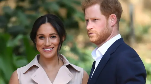 Britain's Prince Harry (R), the Duke of Sussex, and his wife Meghan (L), the Duchess of Sussex, attend a creative industries and business reception at the High Commissioner's residence in Johannesburg, South Africa, 02 October 2019.