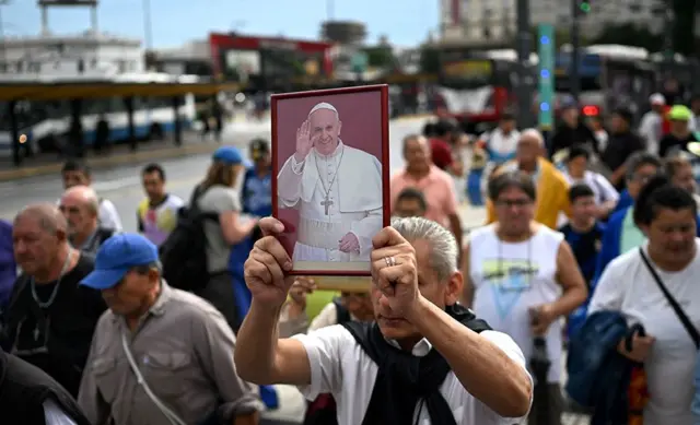 One man hold portrait of Pope Francis for mass for im healing for Constitution Square, Buenos Aires, Argentina, on 24 February 2025.