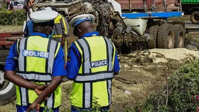 Police officers inspect incident site after one truck and two cars crash for di Nakuru-Eldoret highway wit at least 8 casualties for Nakuru city of Kenya on December 31, 2023.