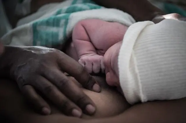 A mother looks after her newborn baby in hospital in Nantes, western France, on July 7, 2018. During a press-conference on January 16, 2024 French President Emmanuel Macron's laid out plans to revive France's sluggish birth rate, promising better parental leave and combat infertility, which he called "the taboo of the century". In 2023, France registered 678,000 births, a drop of 6.6 percent from the previous year, the lowest annual rate since World War II