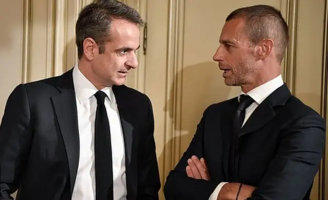 Greek Prime Minister Kyriakos Mitsotakis talks with Uefa president Aleskander Ceferin in February 2020