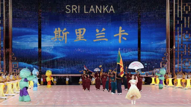 Members of Team SriLanka take part in the athletes parade during the opening ceremony of the 19th Asian Games at the Hangzhou Olympic Sports Centre Stadium on September 23, 2023 in Hangzhou, Zhejiang Province of China