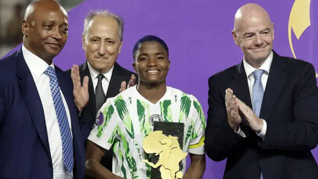 Rasheedat Ajibade pose wit her Woman of di Tournament trophy afta di 2024 Women's Africa Cup