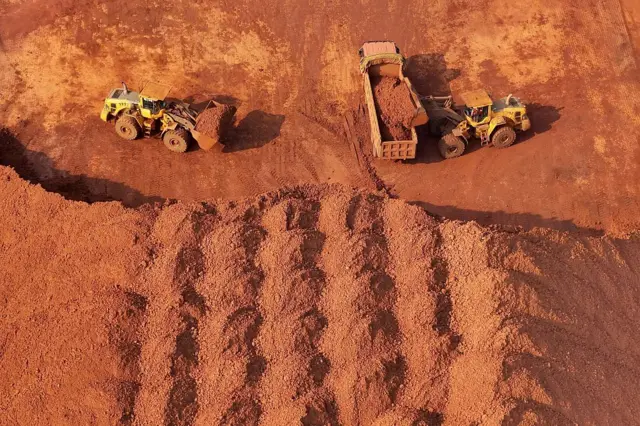 Concentrated bauxite and iron ore at the ore terminal in Yantai Port, Shandong, China on October 29, 2025, (Photo credit should read CFOTO/Future Publishing via Getty Images)