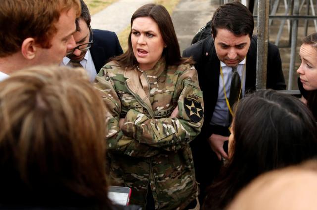 In a borrowed U.S. Army jacket to keep warm, White House Press Secretary Sarah Huckabee Sanders updates reporters on President Donald Trump"s failed attempt, preempted by weather, to visit Observation Post Ouellette along the Demilitarized Zone (DMZ) in the truce village of Panmunjom dividing North Korea and South Korea outside Seoul, South Korea, November 8, 2017. REUTERS/Jonathan Ernst