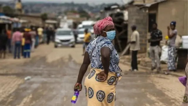 Woman wey dey wear mask for face