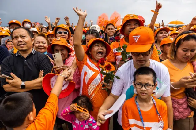 PATTAYA, THAILAND - JULY 22: Supporters of Thailand's Move Forward Party listen to a speech by party leader, Pita Limjaroenrat on July 22, 2023 in Pattaya, Thailand. Pita Limjaroenrat, leader of Thailand's Move Forward Party, greets supporters during a rally at Jomtien Beach in Pattaya, Thailand. Though Pita's party received the biggest share of the popular vote, his pathway to the prime ministership was blocked after the criminal court accepted a case alleging his election ineligibility and lawmakers denying him chance to stand for a second vote. (Photo by Lauren DeCicca/Getty Images)