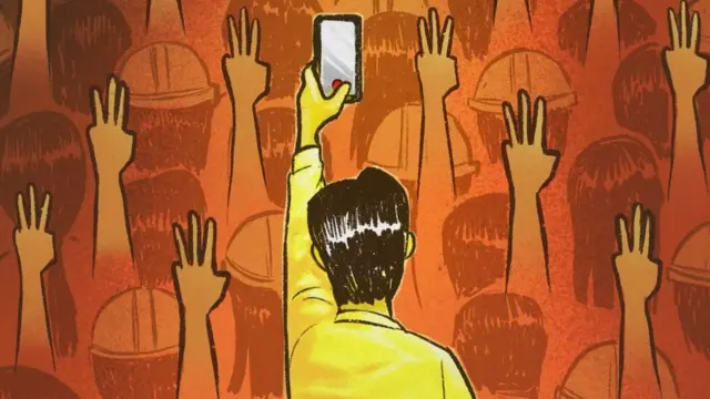 కెమెరా వెనుక వ్యక్తి