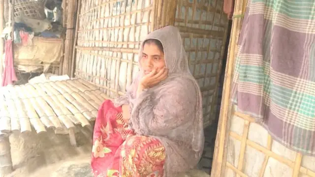 Sharifa Khatun sitting in the refugee camp 