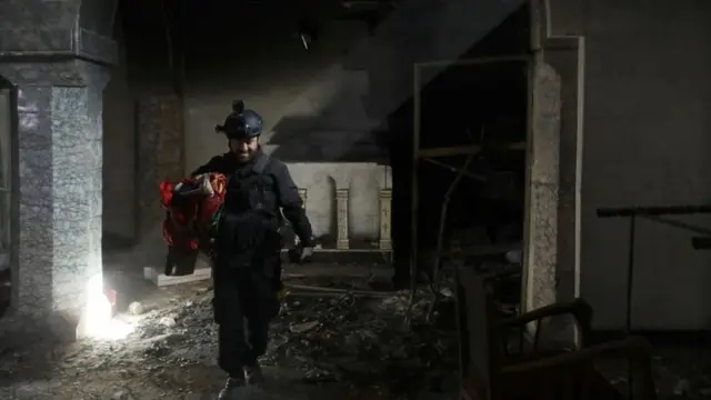 A Christian Iraq special forces soldier in a church in Bartella, a Christian town recaptured from IS, 22 October 2016