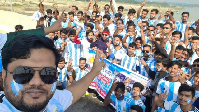 A large group of fans celebrating after Argentina's win over The Netherlands.