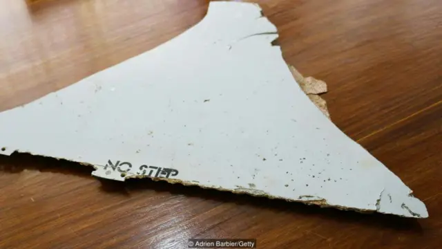 Gibson knew the part was from a plane when he saw the words "No Step" on it