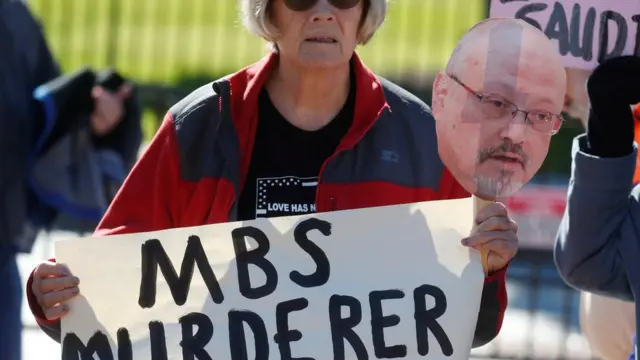 An activists holds a sign and image of missing Saudi journalist Jamal Khashoggi during a demonstration calling for sanctions against Saudi Arabia and to protest Khashoggi"s disappearance, outside the White House in Washington, U.S., October 19, 2018.