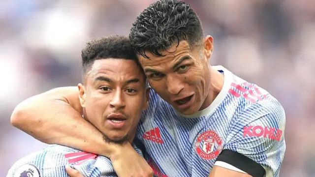 Match-winner Jessie Lingard is hugged by Cristiano Ronaldo