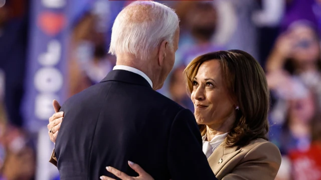 Kamala Harris and U.S. President Joe Biden greet each other in a hug