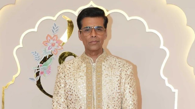 Indian filmmaker and TV personality Karan Johar wear white kurta