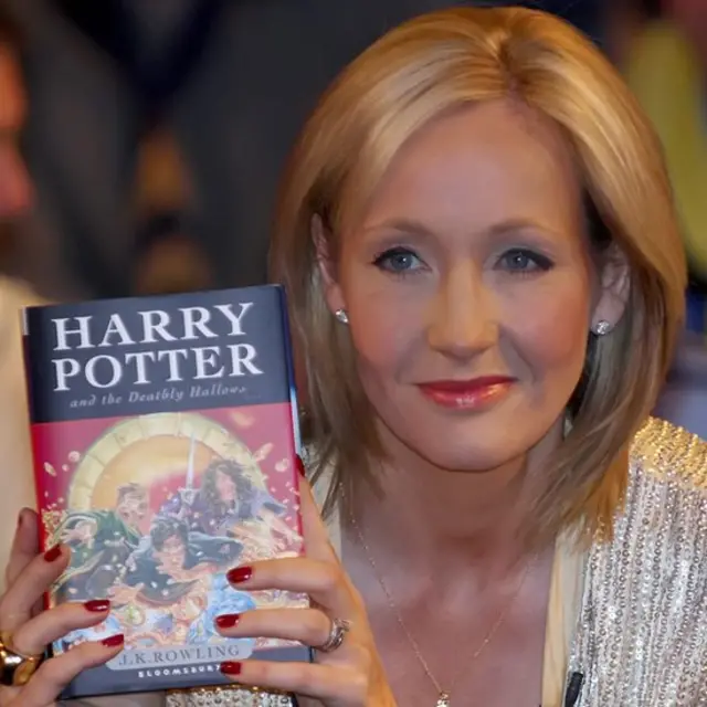 JK Rowling with Harry Potter book
