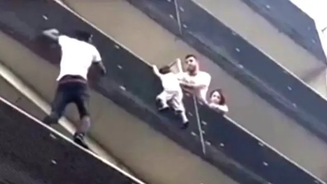 Mamoudou Gassama scales building to rescue child. 27 May 2018