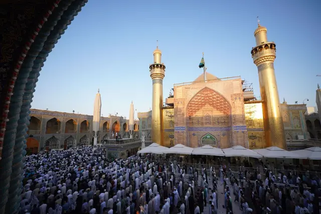 NAJAF, IRAQ - JUNE 07: Iraqi Shiite Muslims gather to perform Eid al-Adha prayer at the yard of the Imam Ali Shrine in Najaf, Iraq