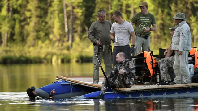 TYVA REPUBLIC, RUSSIA - AUGUST 5, 2017: Russia's President Vladimir Putin (C front), Russia's Defense Minister Sergei Shoigu (L background), Sholban Kara-ool, head of the Republic of Tyva, and Viktor Zimin (R-L), head of the Republic of Khakassia, fishing. Alexei Nikolsky/Russian Presidential Press and Information Office/TASS (Photo by Alexei Nikolsky\TASS via Getty Images)