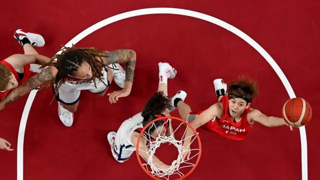 Tokyo 2020 Olympics - Basketball - Women - Gold medal match - United States v Japan - Saitama Super Arena, Saitama, Japan - August 8, 2021. Rui Machida of Japan in action with Sue Bird of the United States