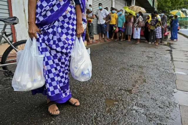 Woman holding a grocery bag