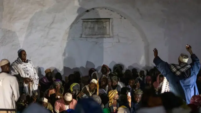 Oromo pilgrims praying in the night during the pilgrimage, Oromia, Sheik Hussein, Ethiopia on August 11, 2019 in Sheik Hussein, Ethiopia