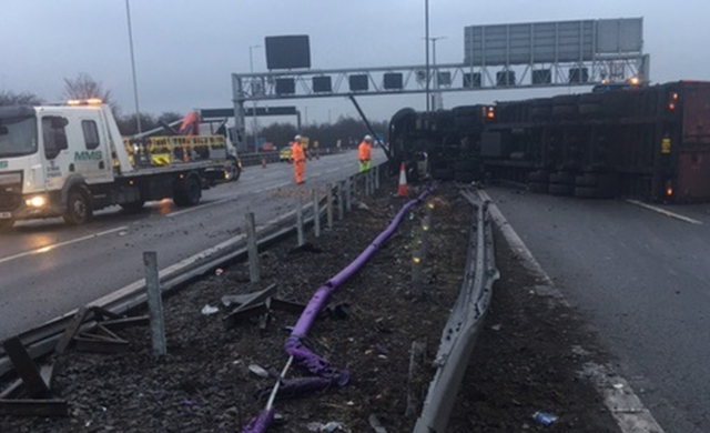 M6 closes at Walsall after lorry crashes through central barrier