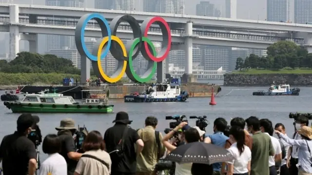 Olympic rings being moved