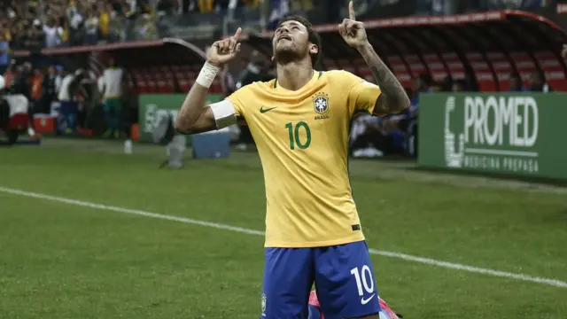This file photo taken on March 29, 2017 shows Brazil"s forward Neymar celebrating after scoring against Paraguay during their 2018 FIFA World Cup qualifier football match in Sao Paulo